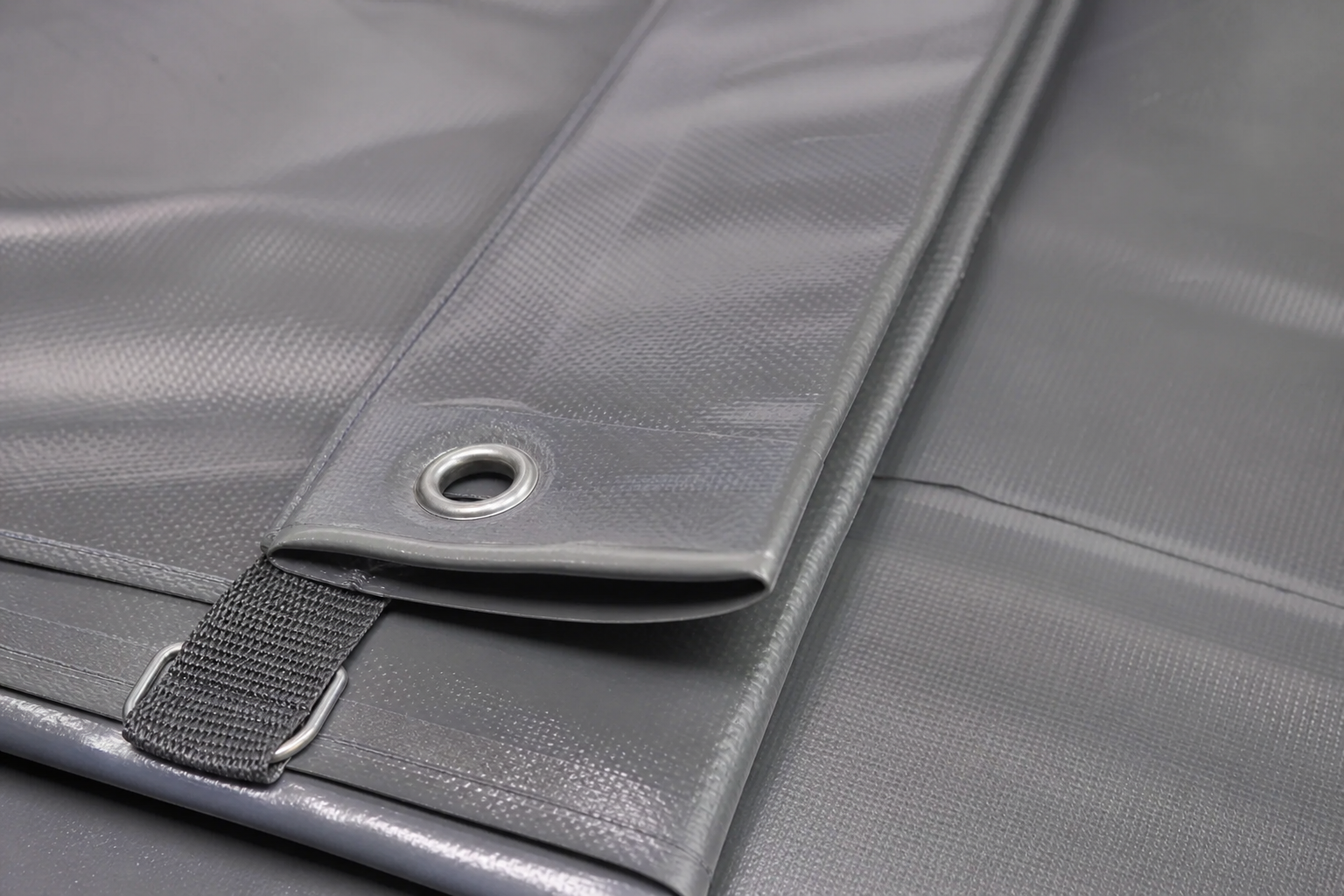 Close-up of PVC coated equipment-cover material with welded hem and thin realistic edge