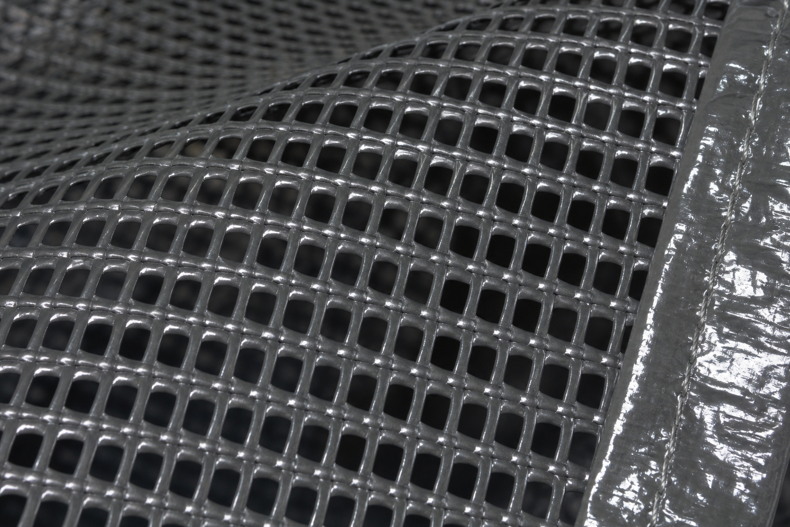 PVC coated mesh tarp material close-up showing coated yarns and open ventilation structure