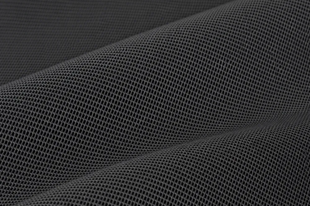 Black coated mesh tarp material showing an open structure for airflow and partial shade