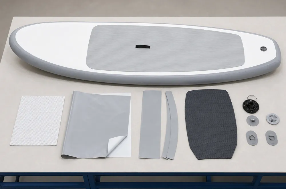 Inflatable SUP and component samples arranged on a worktable