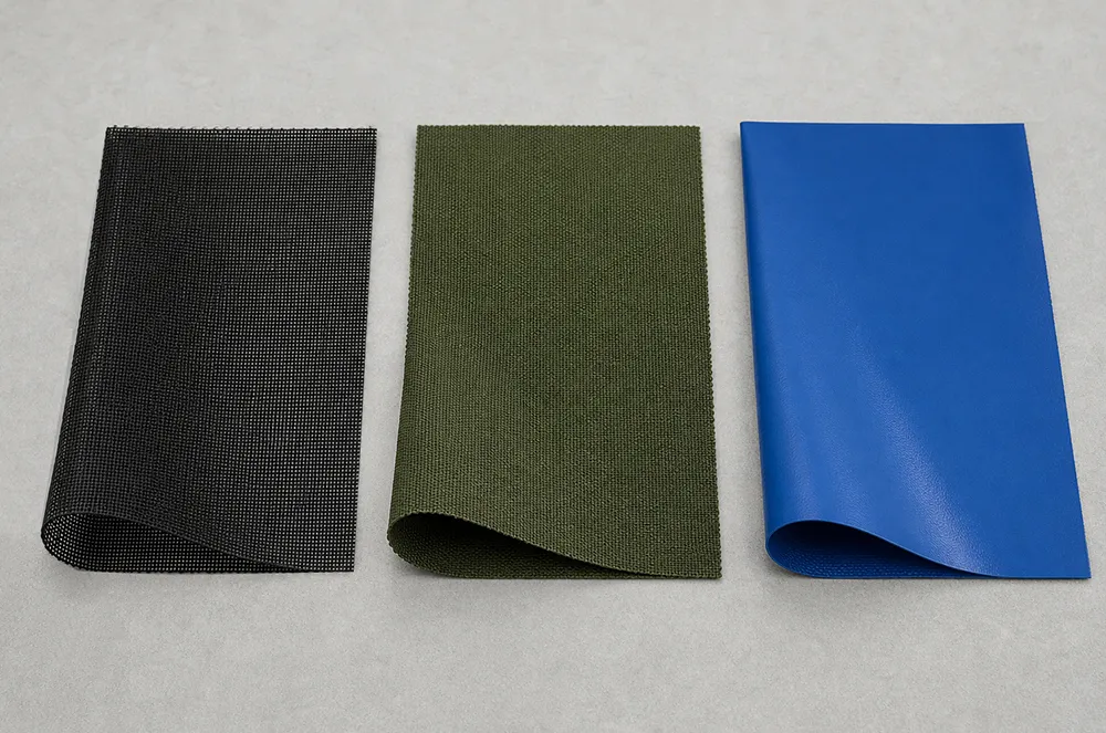 Black mesh, green woven and blue solid coated scaffold tarp material samples