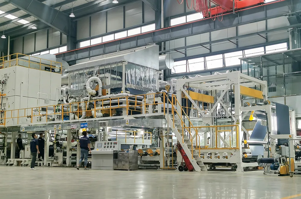 Coated fabric production line operating inside a manufacturing plant