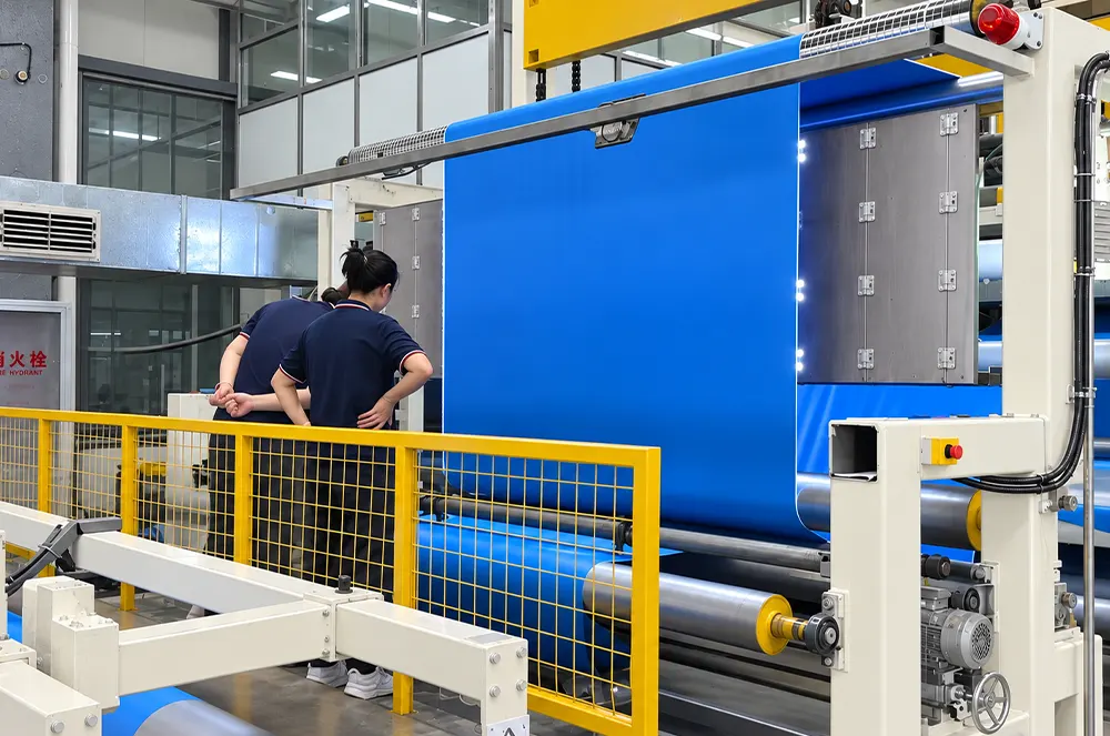 Operator beside tarpaulin material on equipment
